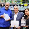  
  Senator Gustavo Rivera and Dr. Salcedo Holding Water while Mr.Diaz is Holding Award